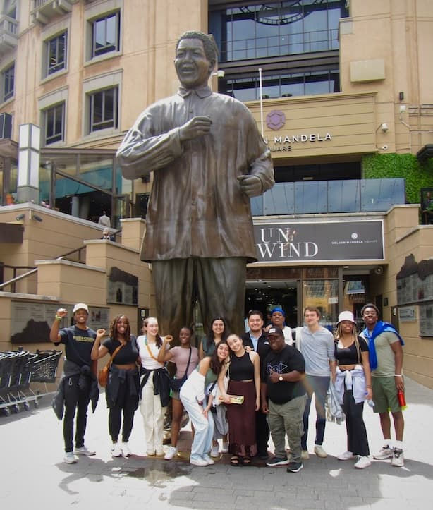 Sophia Shaeen, crouching at center, with fellow Arrupe volunteers in South Africa.