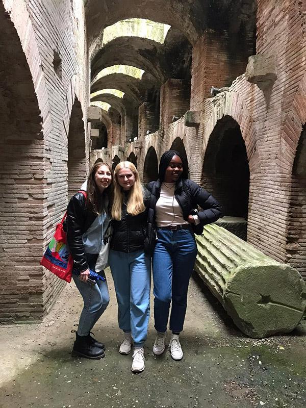 Three students in an ancient site