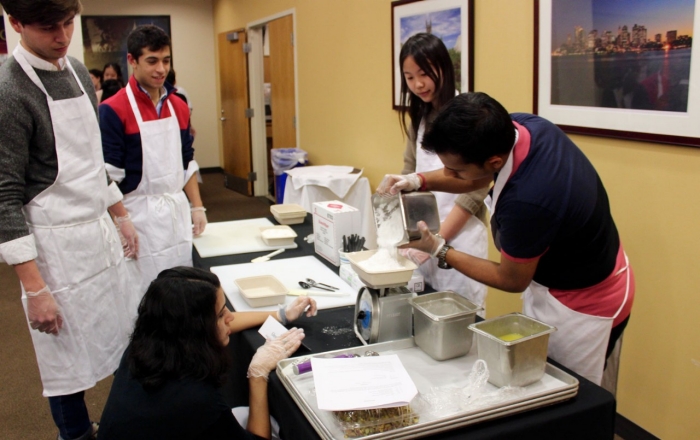 Photo of Students Preparing Part of the Meal
