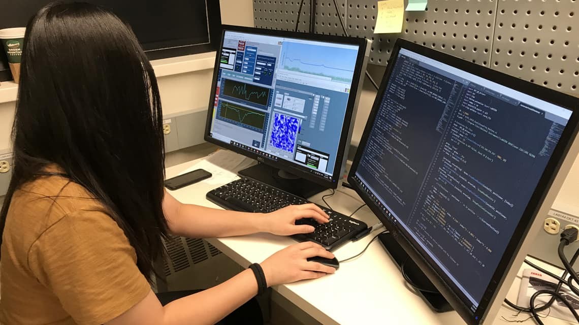 Student controlling scientific instrument with a computer