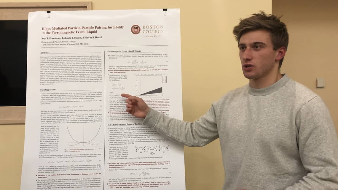 Student with research poster