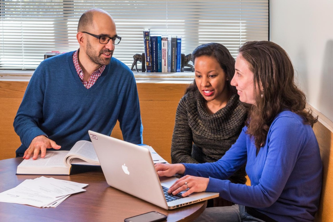 Photo of Image of professor teaching two people