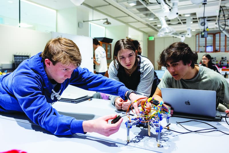 Students program and evaluate a robot prototypeStudents engage in a yoga practice on the Bapst lawn