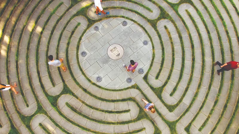Students meditate, pray, and reflect as they walk outside the Burns Library