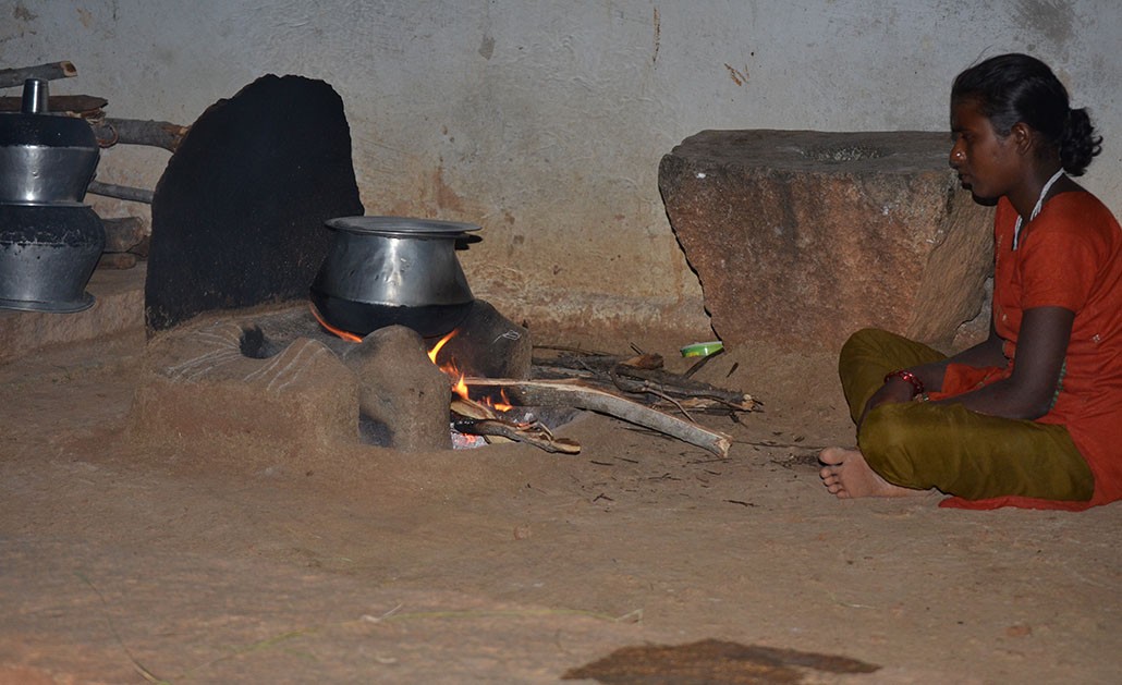 A woman uses a traditional cookstove in a village in Andhra Pradesh, India.