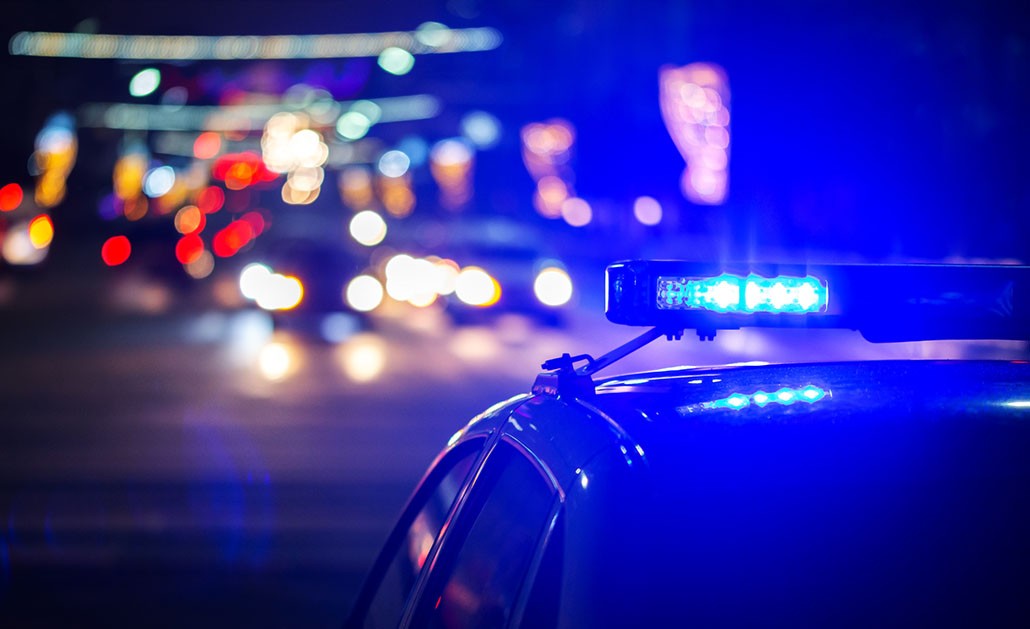 A police car with its siren on