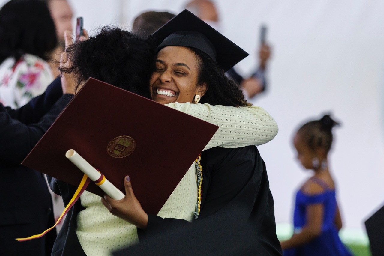 Students celebrate with diploma in hand