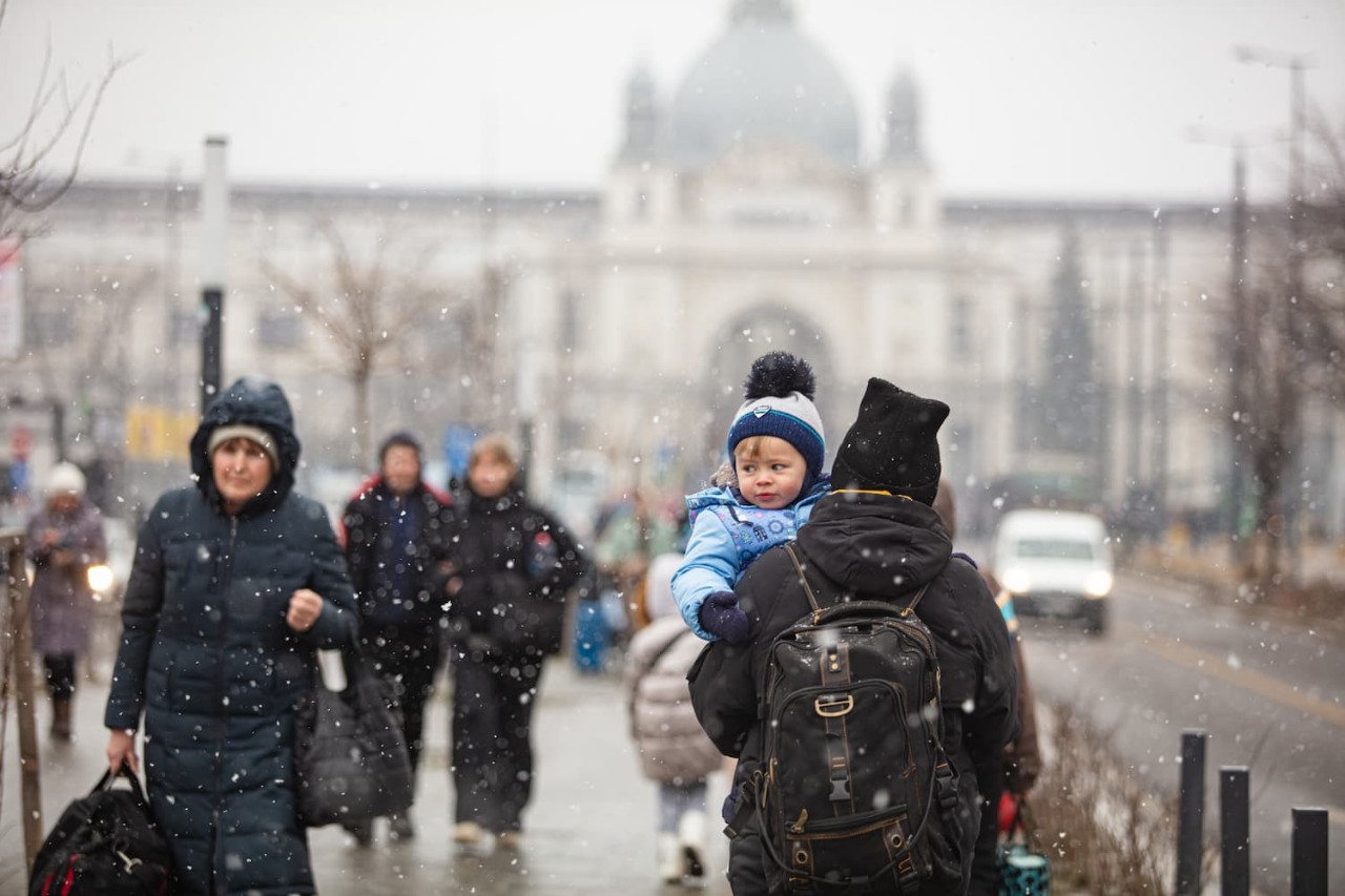 An adult holds a child in Ukraine