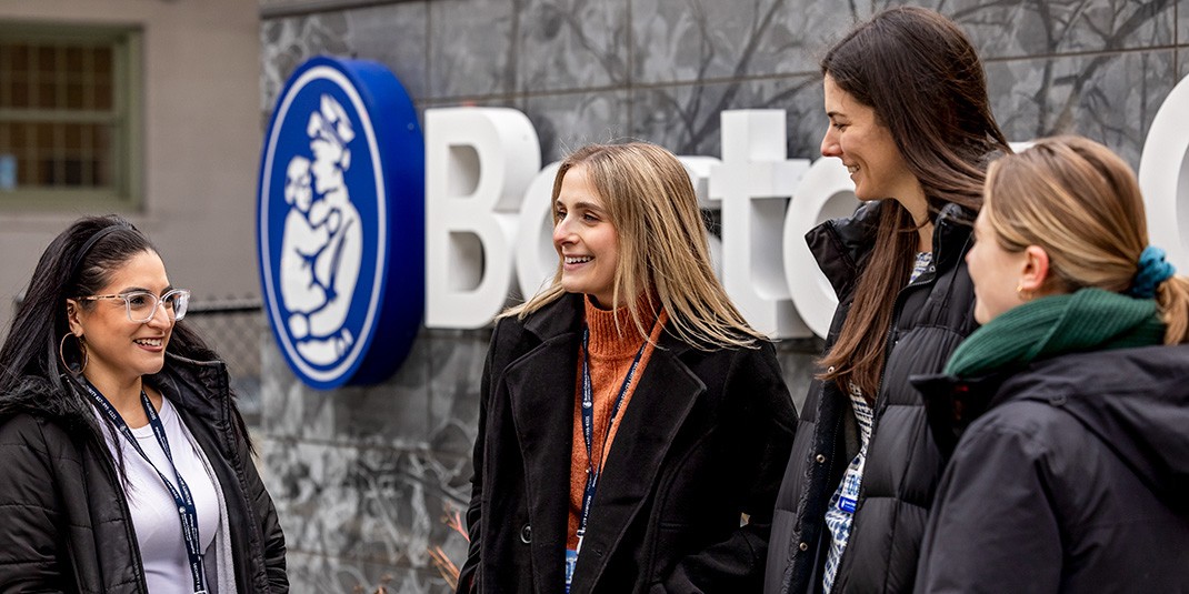 Students chat in front of Boston Children's Hospital