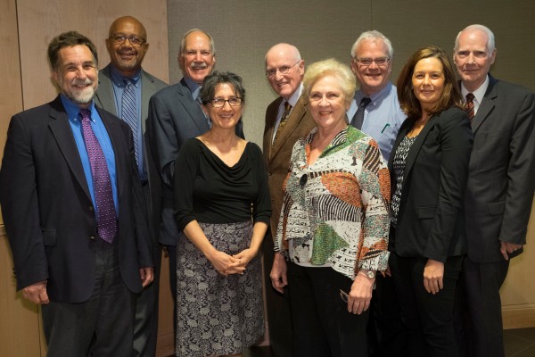 Jim Lubben (center wearing brown jacket) is pictured with fellow members of the Grand Challenges Executive Committee. Photo by Sid Hastings.