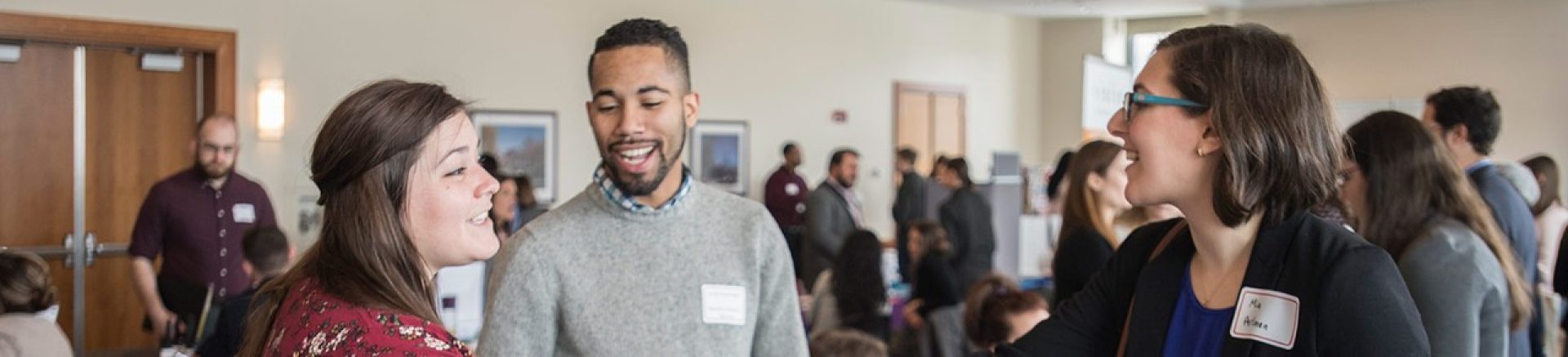 students talking at a conference