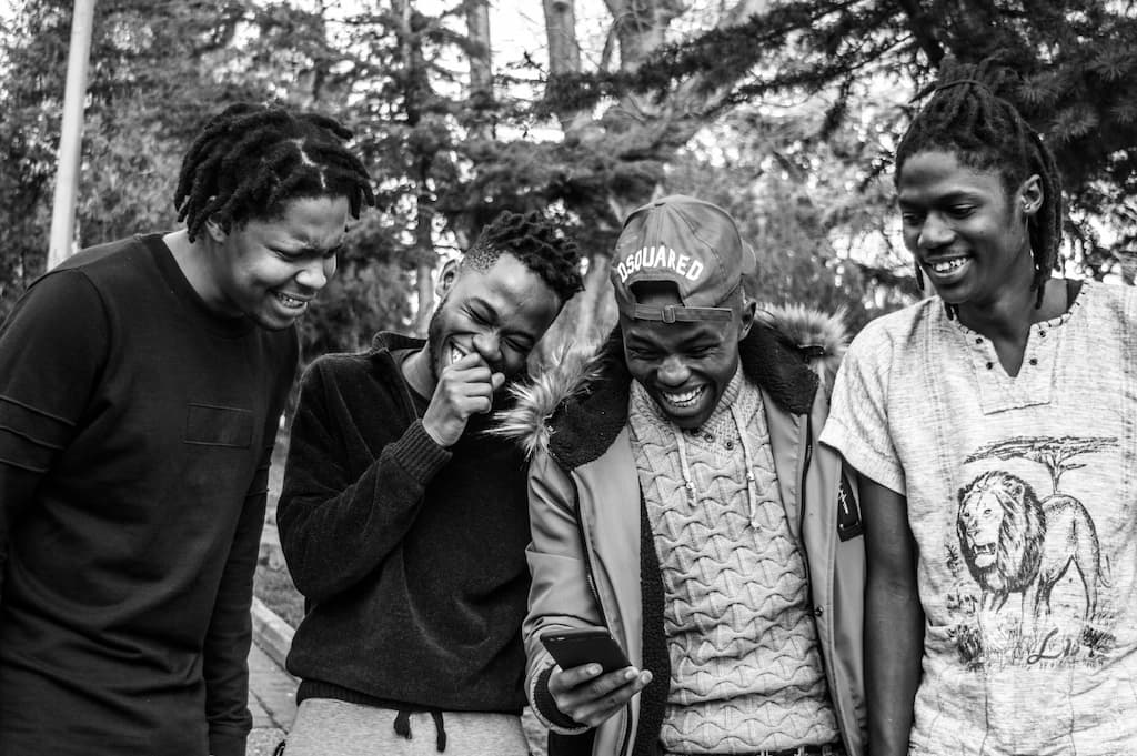 Four men share a jok