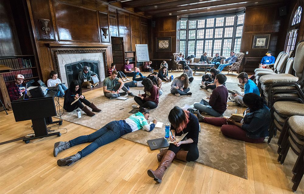 Students reflect during a retreat at the Connors Center