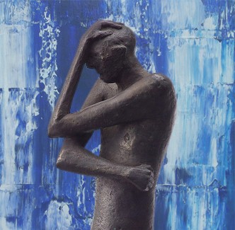Black colored bronze statue of a man bracing himself with an abstract blue background