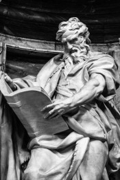 Statue of St. Matthew reading a book