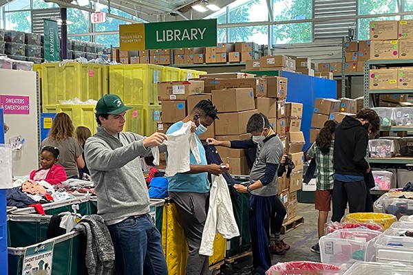 Students sorting clothing