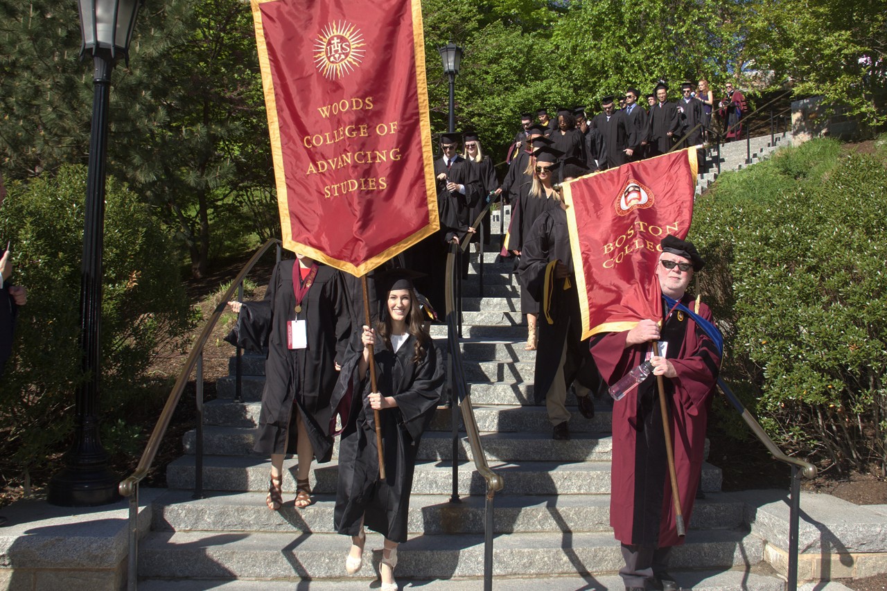 graduate with the Woods College banner