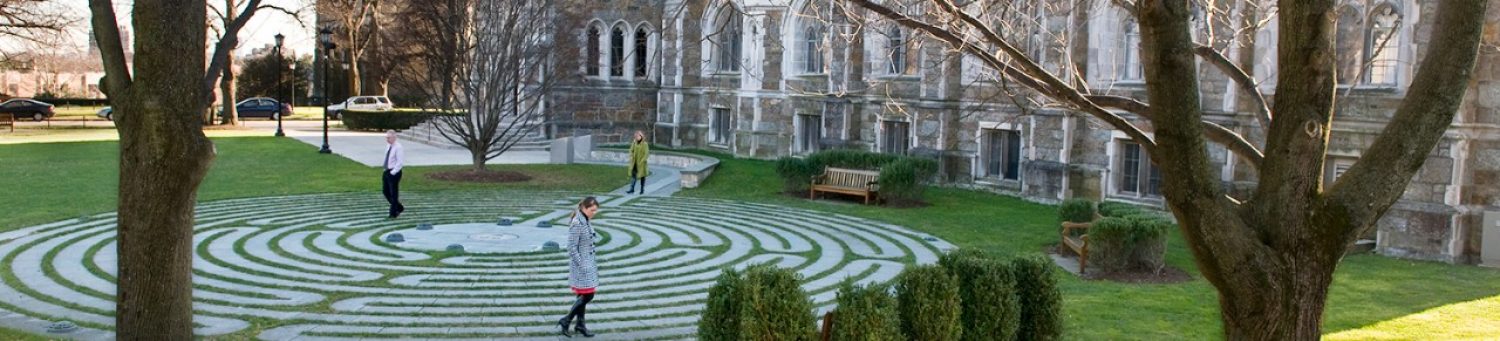 people walking the labyrinth walking path on campus