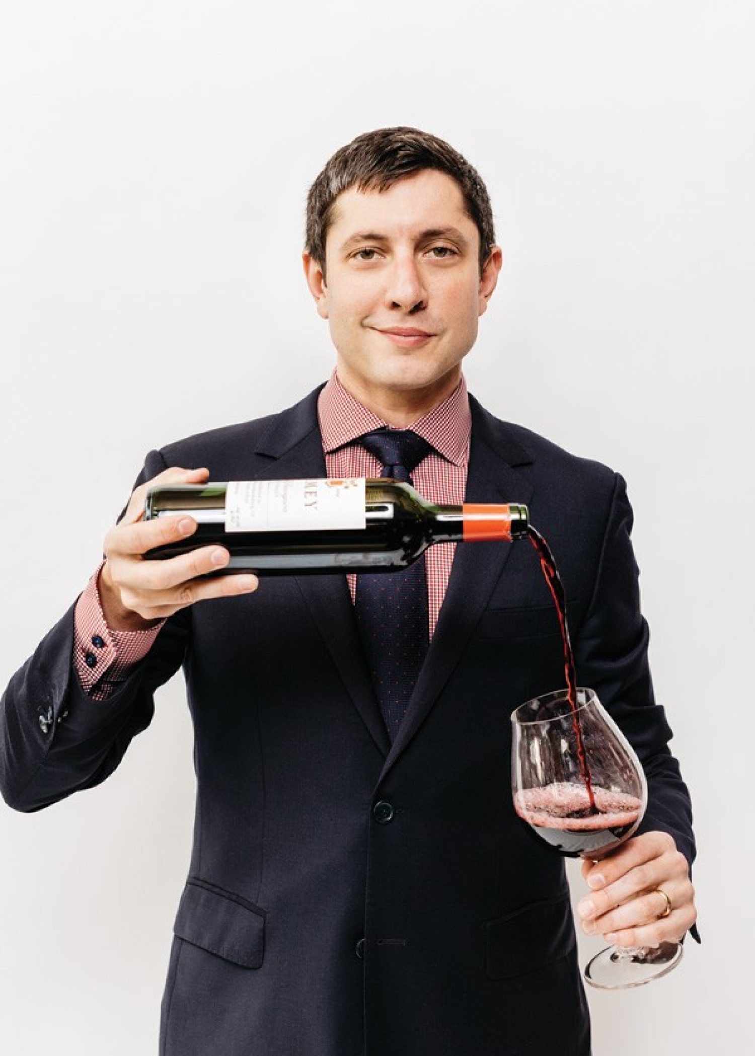Master sommelier Brahm Callahan with a glass of red wine
