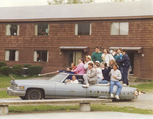 Students packed into a Cadillac