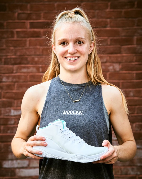 Portrait of Natalie White holding her new sneaker