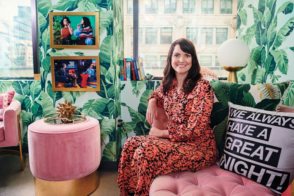 Photograph of Deirdre Connolly seated on a couch