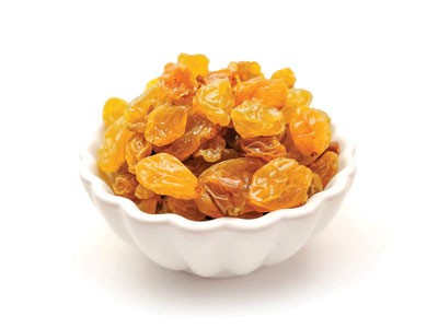 Photo of a bowl of golden raisins