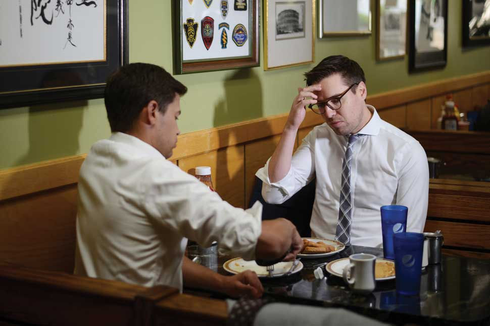 Manzo and Downes having breakfast together at a diner