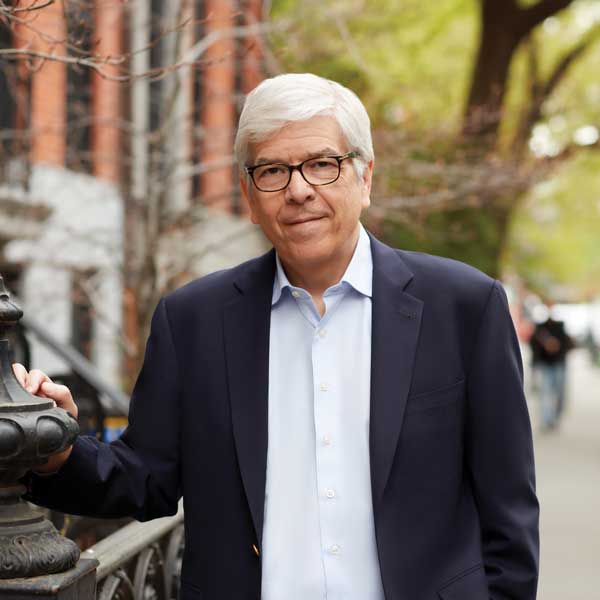 Photo of Paul Romer on a sidewalk