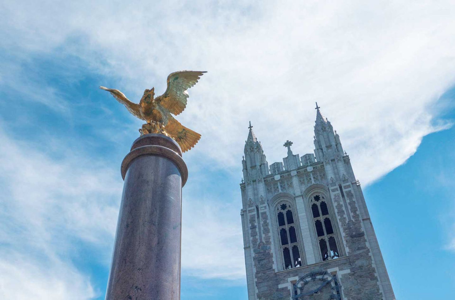 Photo looking up at the eagle and Gasson Hall