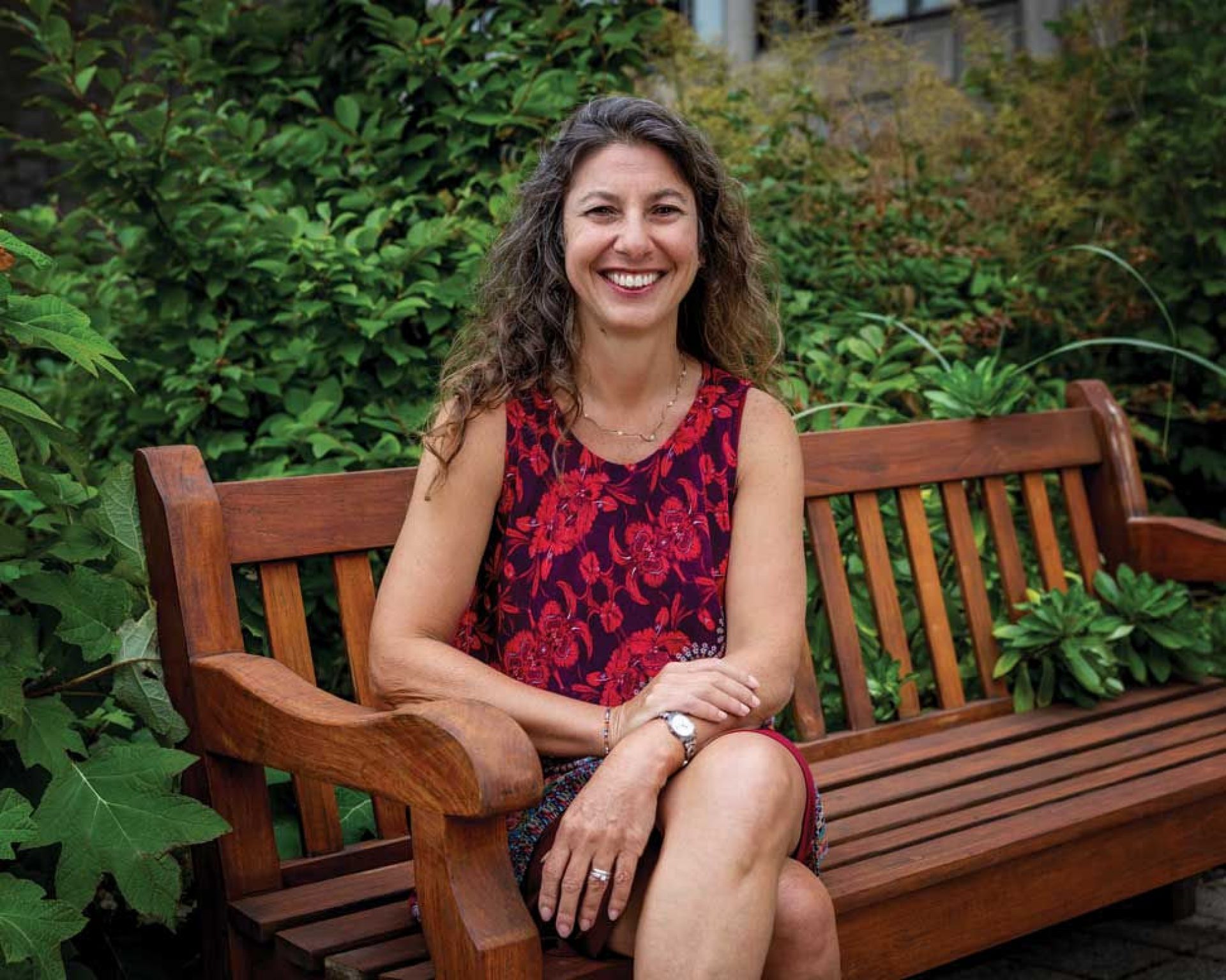 Photo of Marina Umaschi Bers seated on a bench