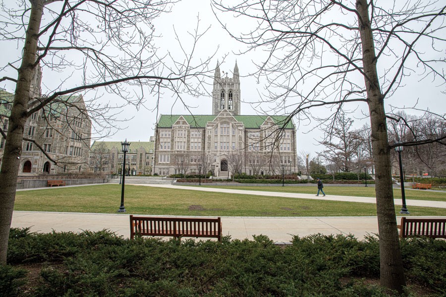 A person walking through an empty O'Neill Plaza.