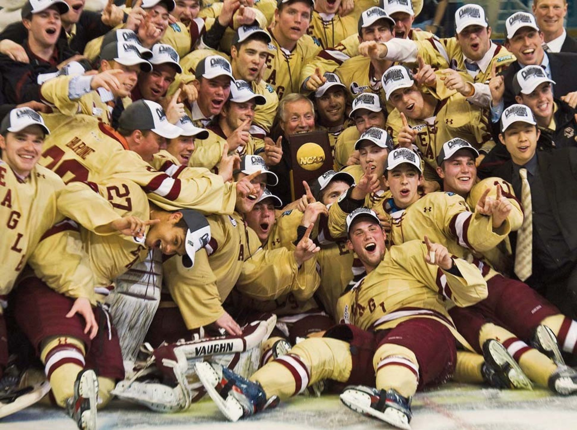 York and trophy surrounded by his team