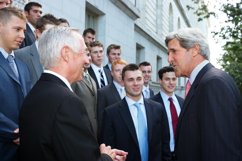 York and Kerry with players in background outside in Washington DC