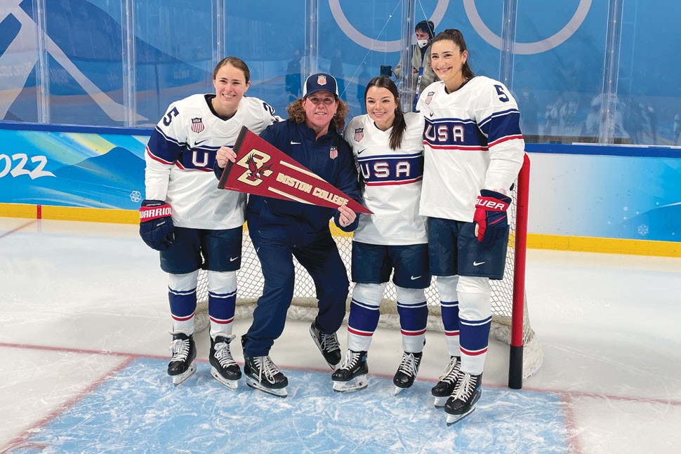 Photo of BC contingent in front of a hockey goal