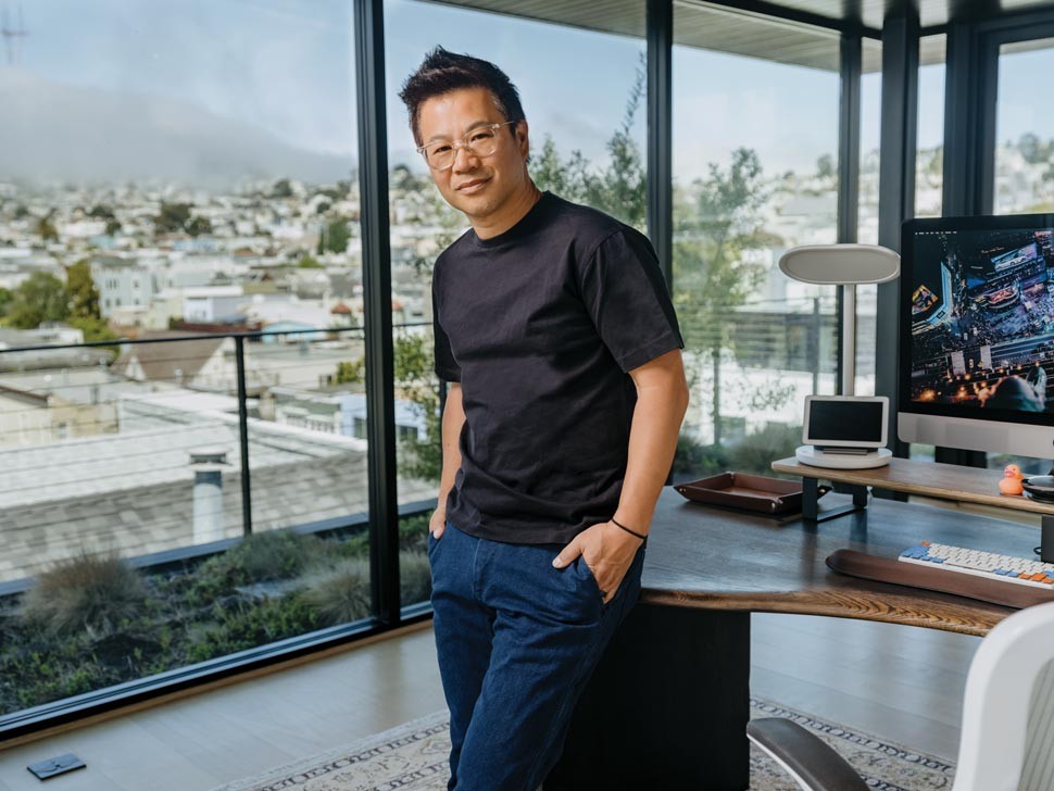 Marvin Chow leaning against his desk