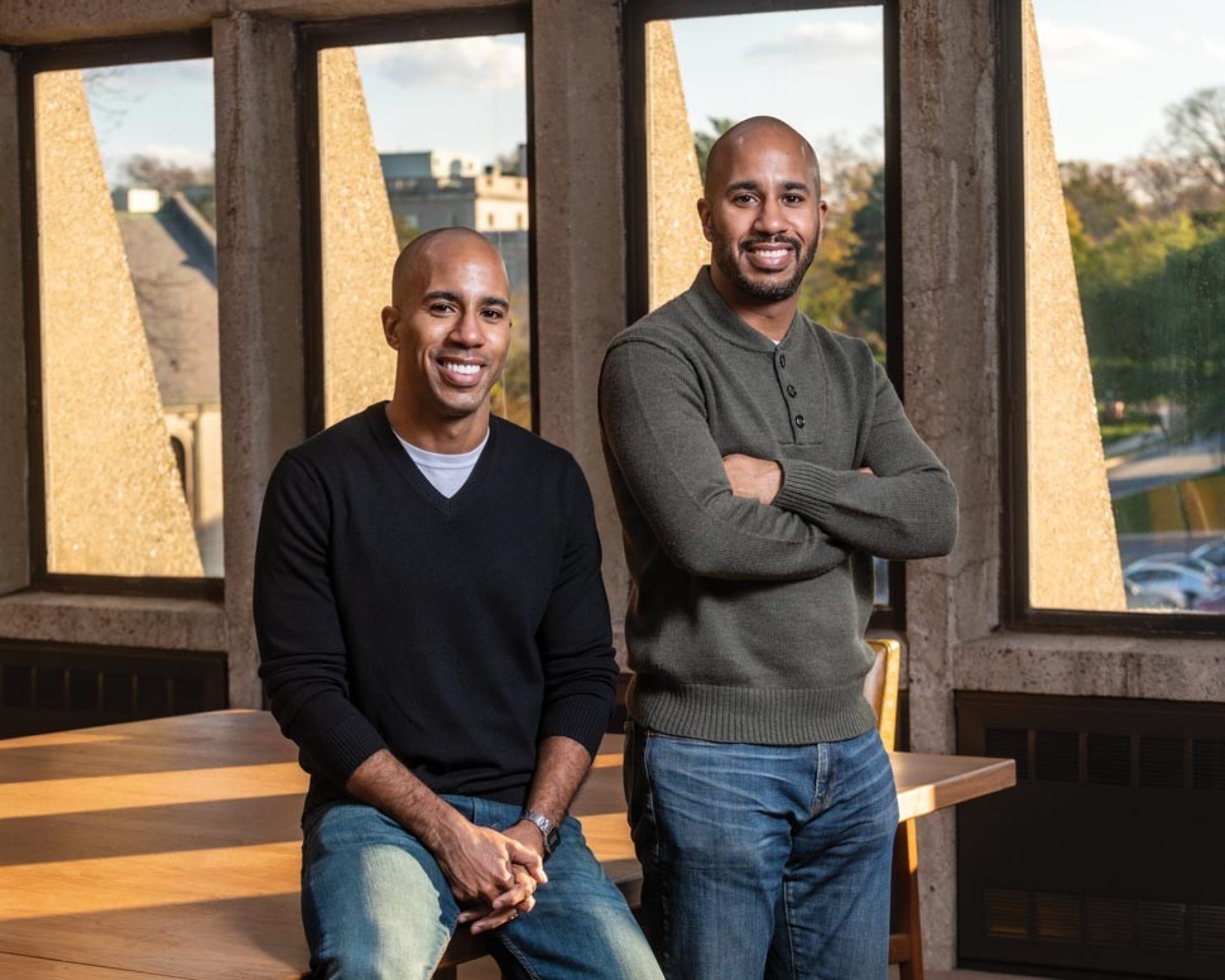 Desmon Lewis ’05 and Derrick Lewis ’06 photographed in the School of Theology and Ministry Library