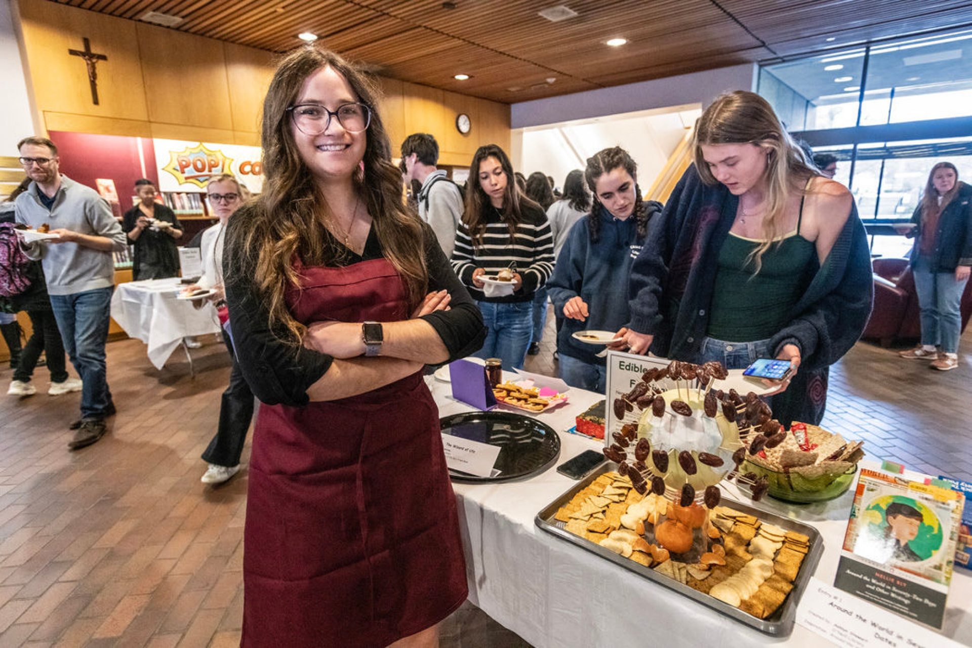 Ashlyn Stewart and her winning entry "Around the World in Seventy-Two Dates" featuring a globe-shaped cake covered with dates on toothpicks