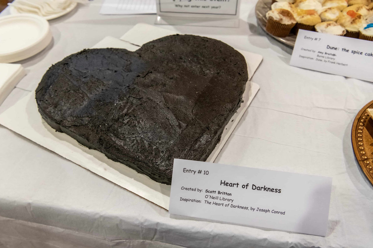 a heart-shaped cake with black frosting for "Heart of Darkness"