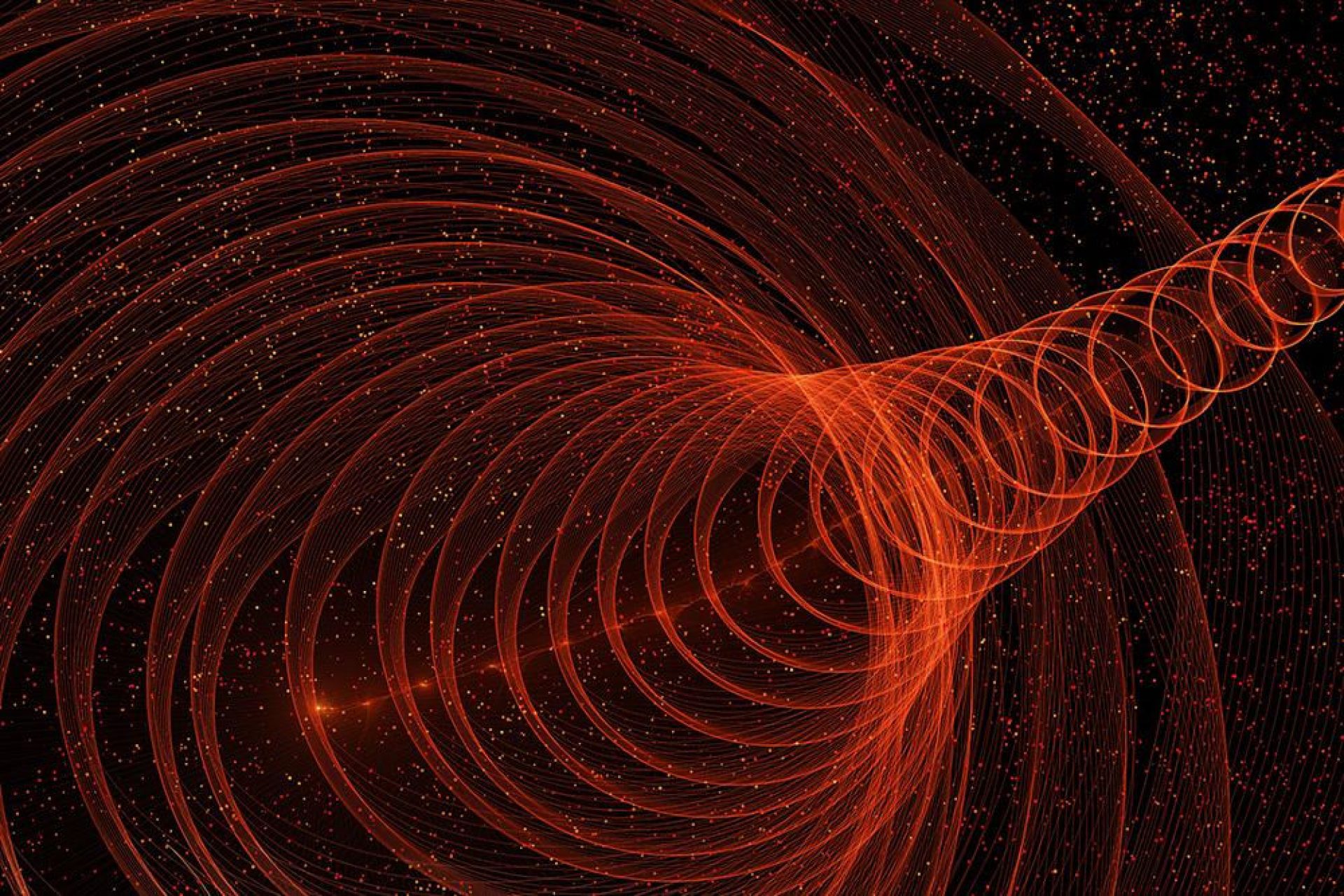 An image showing red particles against a black background
