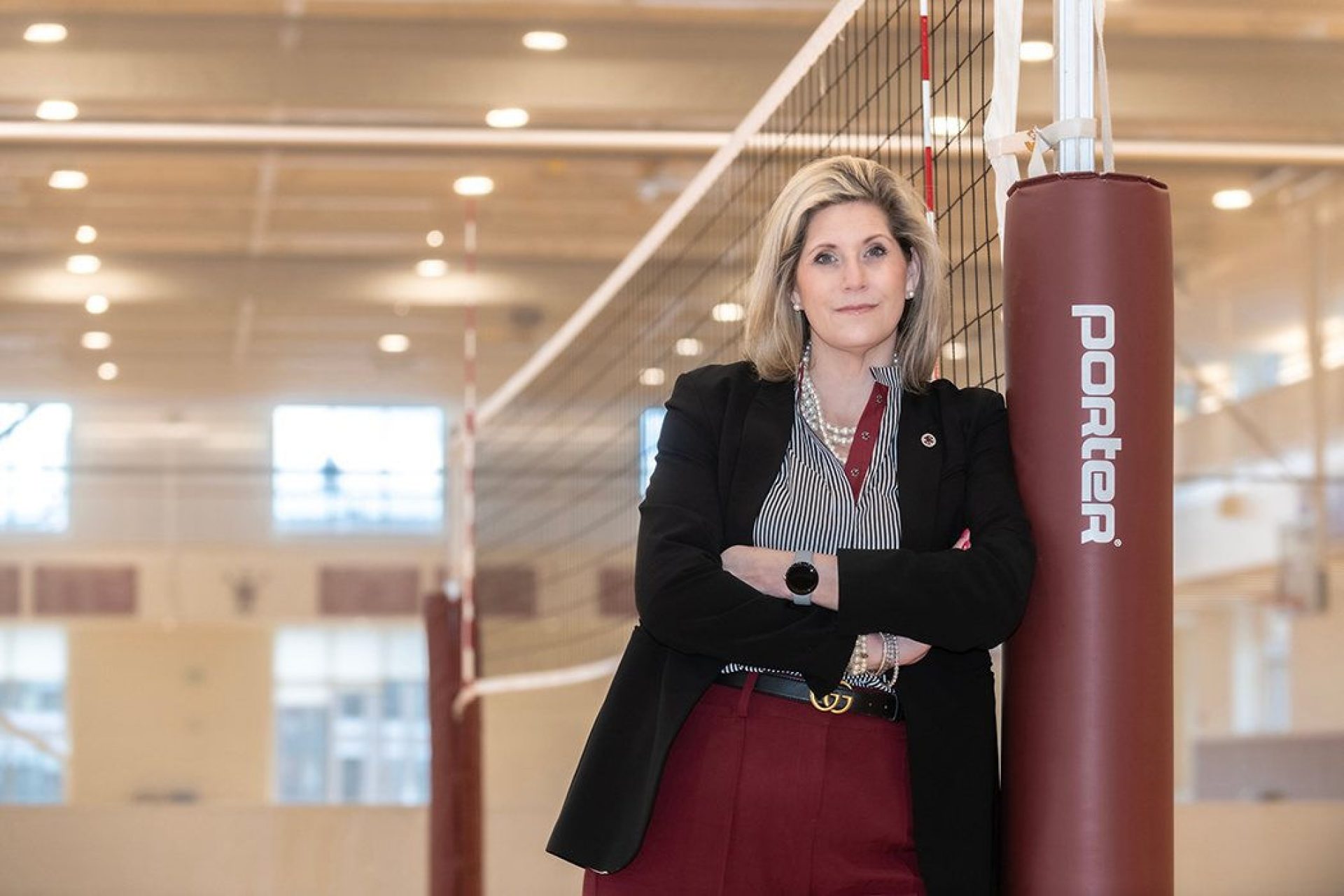 Patty Keller standing on a volleyball court