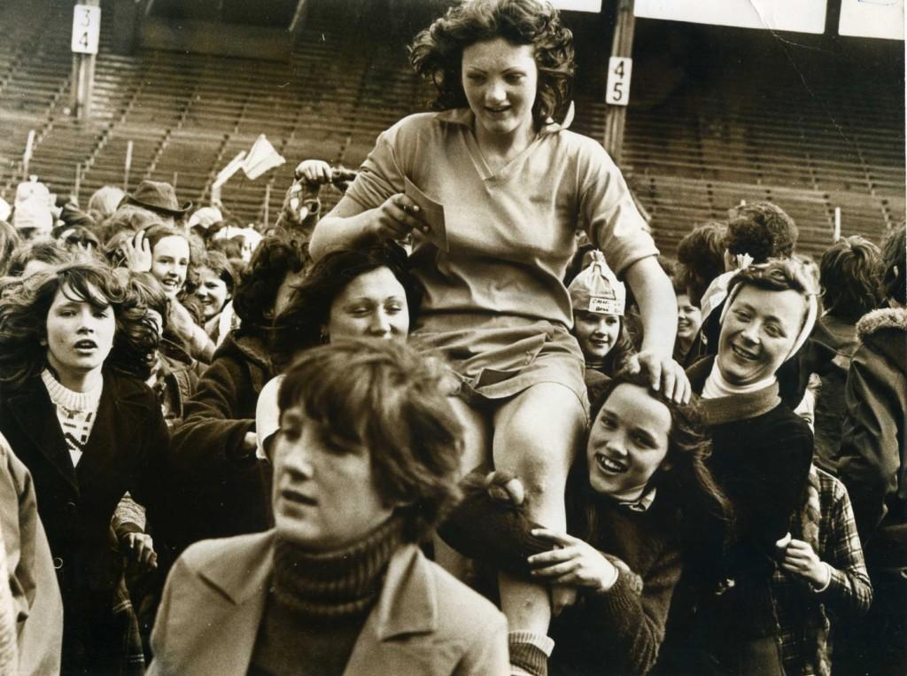 The captain of the Scoil Mhuire Camogie Team, Cashel, is carried shoulder high by supporters. Courtesy of Cumann Camógaíochta na nGael.