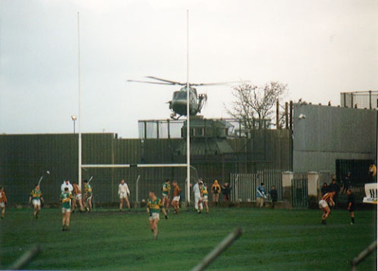 A British Army helicopter taking off from the security base bordering St. Oliver Plunket Park, Crossmaglen, during a GAA match, 2001.