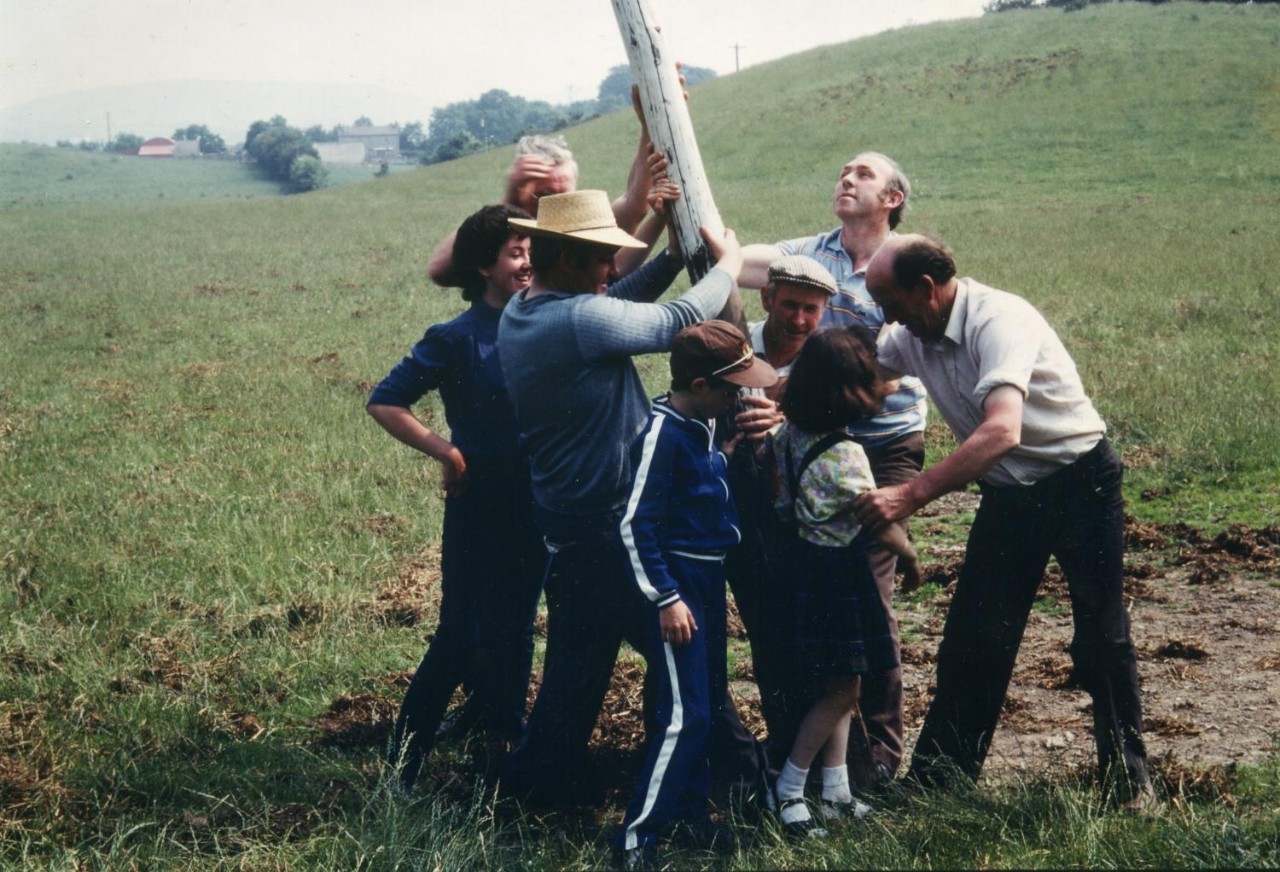 Several generations of Roche Emmets GAA Club in County Louth help remove the goalposts from Treanor's field as the club prepares to move to new facilities in 1983.