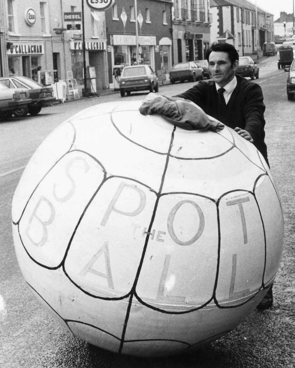 Jim Faughan, from Annaduff, Co. Leitrim, prepares to push Ireland's largest ball through Mullingar in an innovative GAA fundraiser.