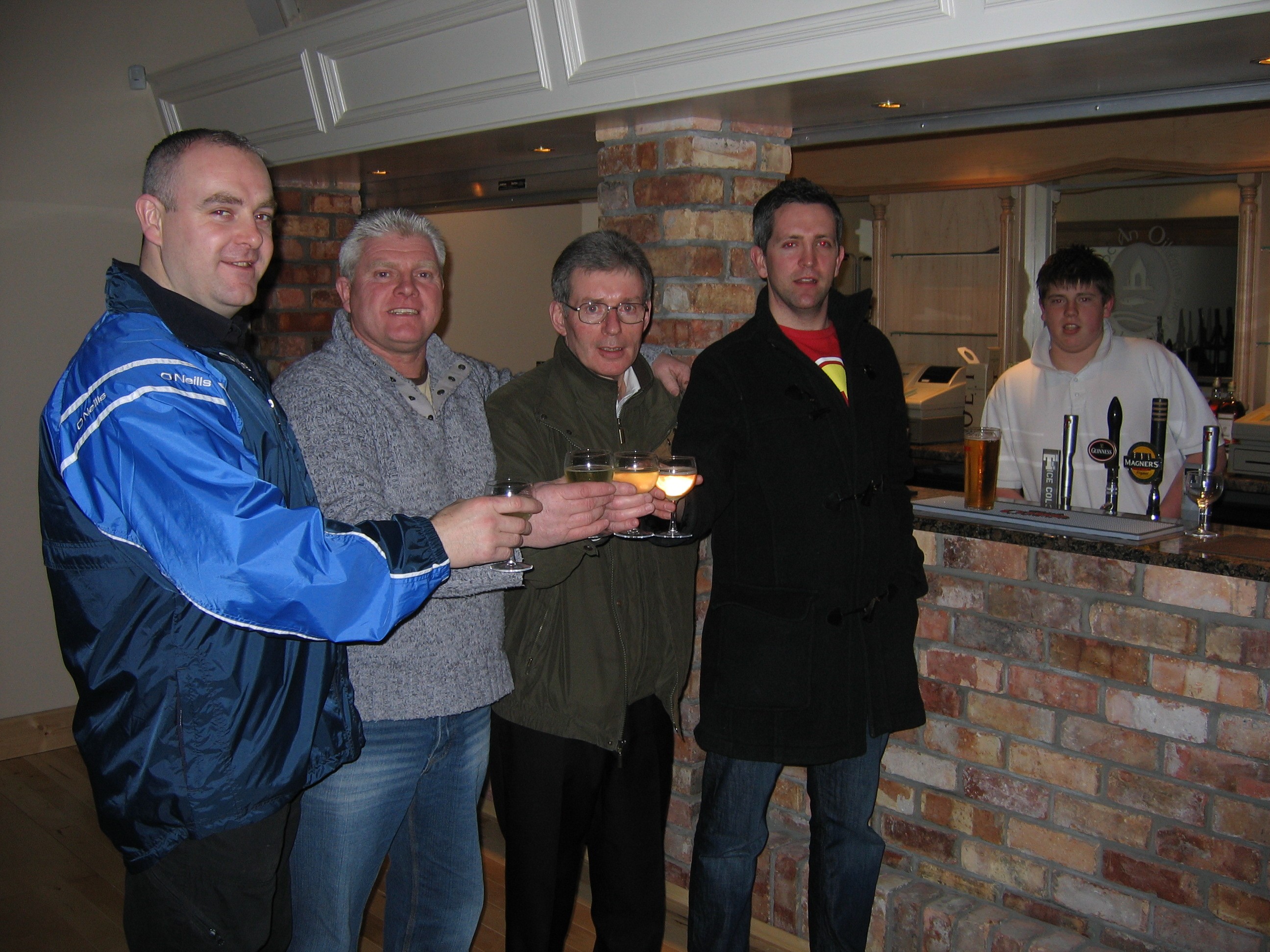 Enjoying their first drink in the new clubhouse in Loughinisland, Co. Down, December 2007.