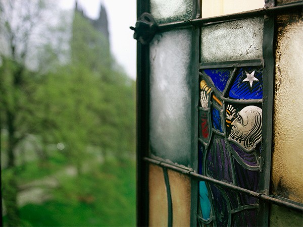 stained glass window of astronomer