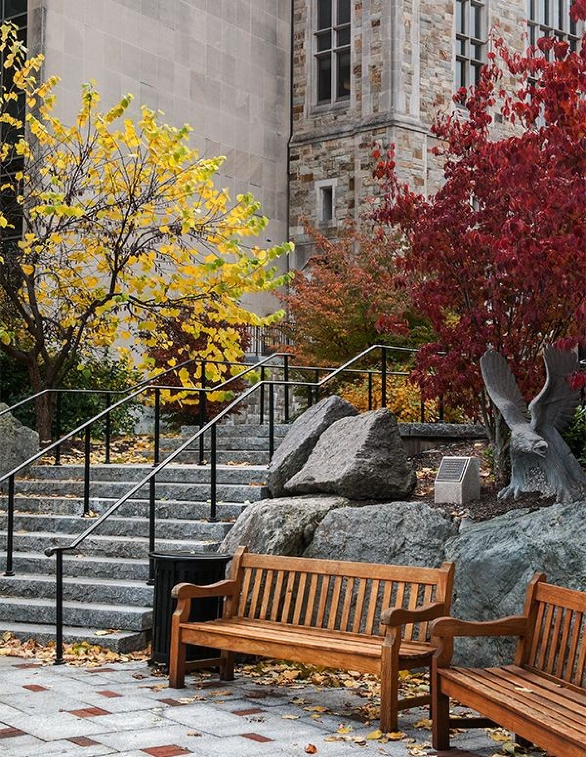 A bench in front of stone steps