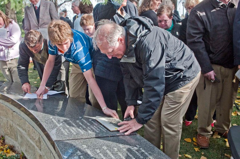 Photo of Family members at the memorial dedication