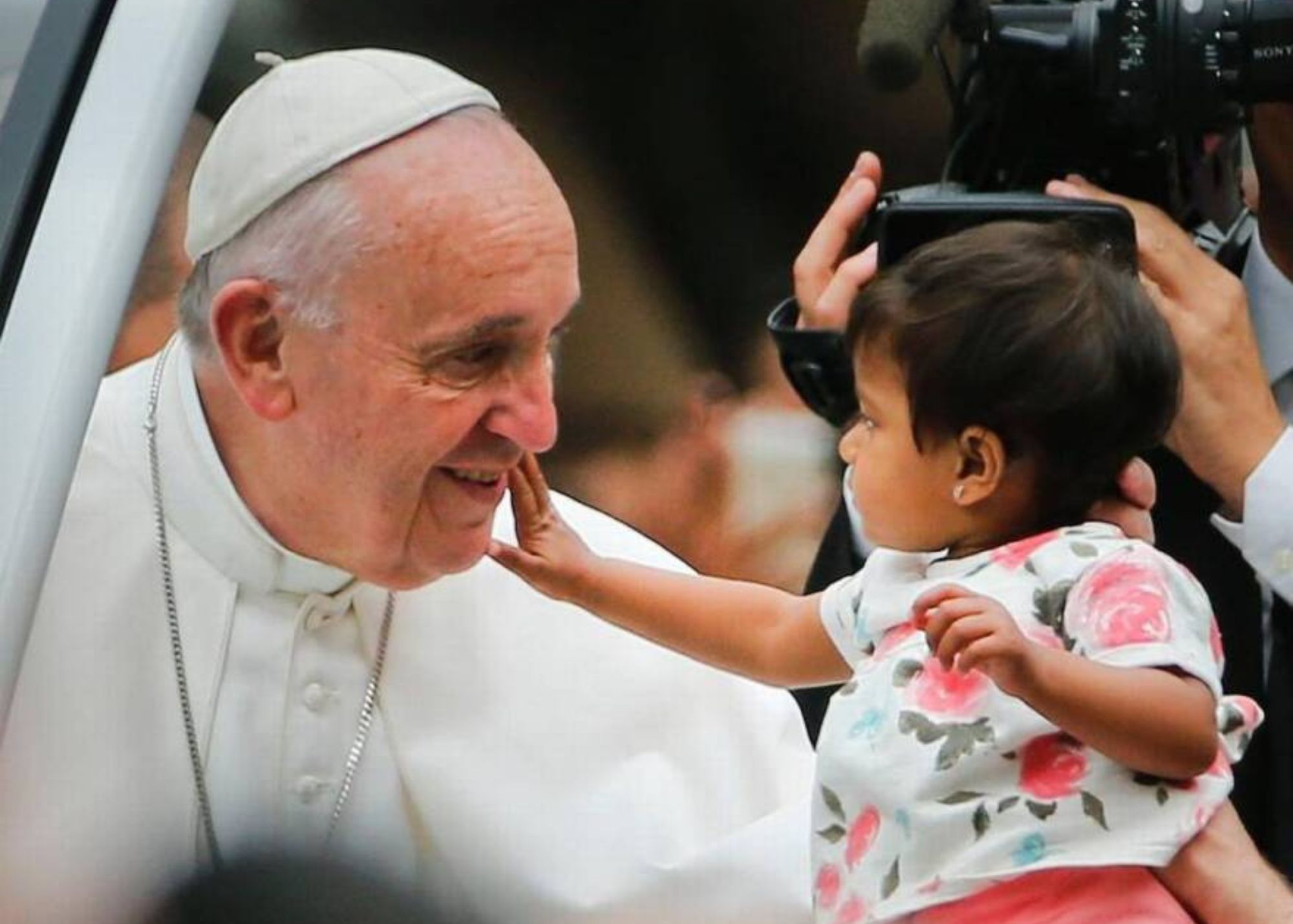 Pope Francis Guiding Light Page Banner  - Pope Francis smiling with a child